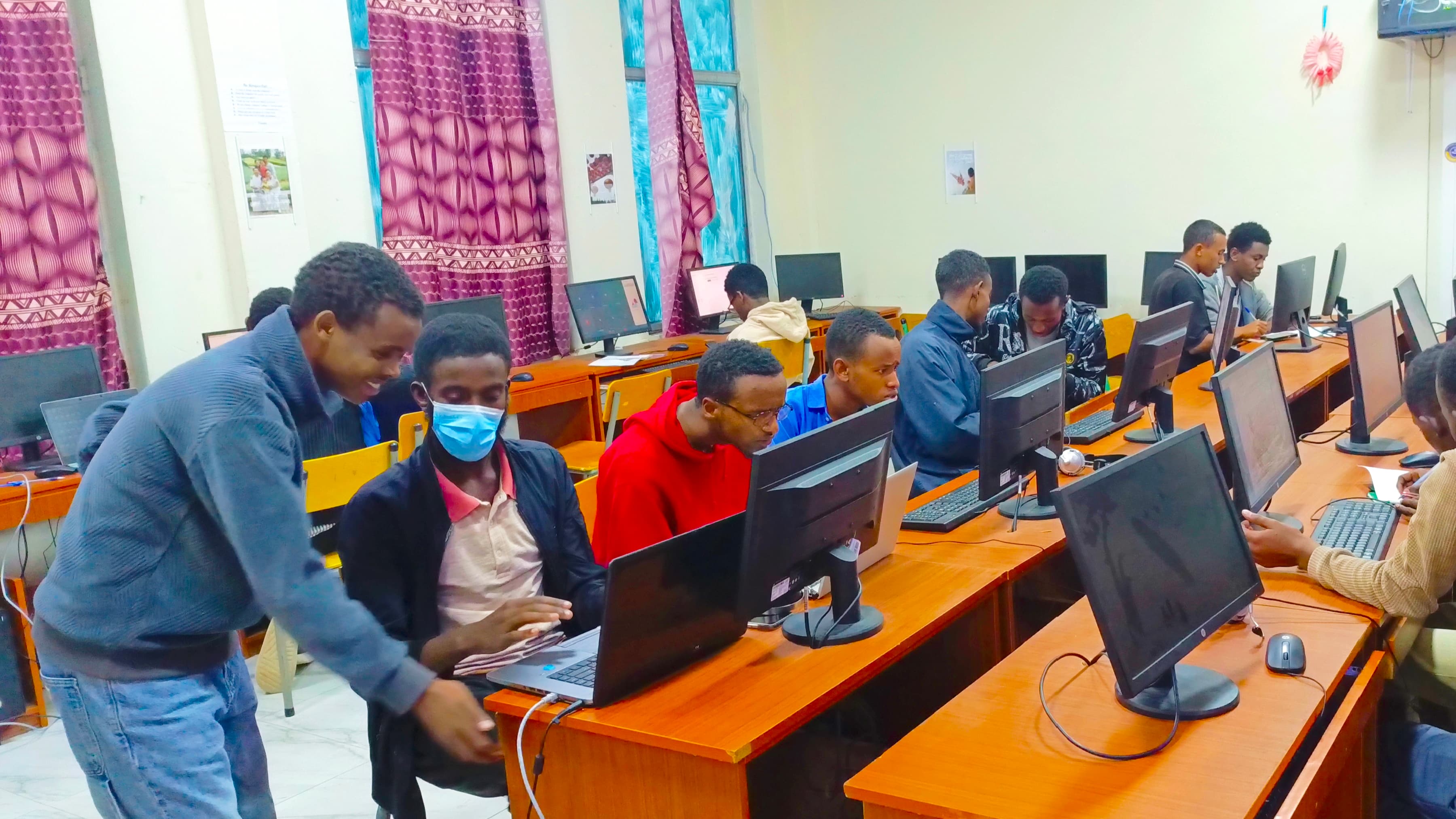 Students collaborating on a Python programming exercise as part of the DoCoder Program